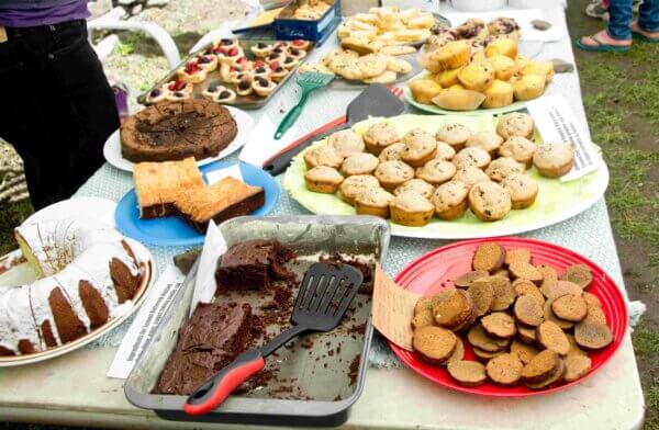 Table of cakes and biscuits set out for sale