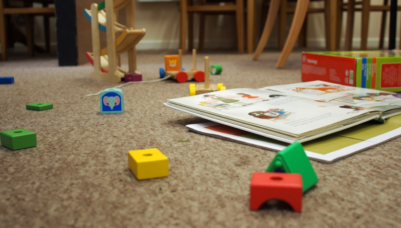 Wooden blocks and toys on a beige carpet